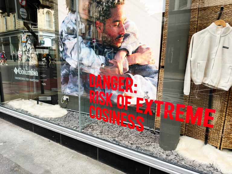 Storefront window graphics and retail branding on glass facade